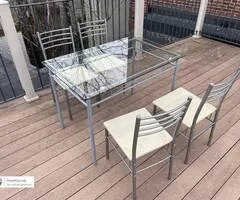 Glass and metal table with 4 chairs - dining set