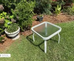 White metal table with tempered glass top