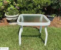 White metal table with tempered glass top